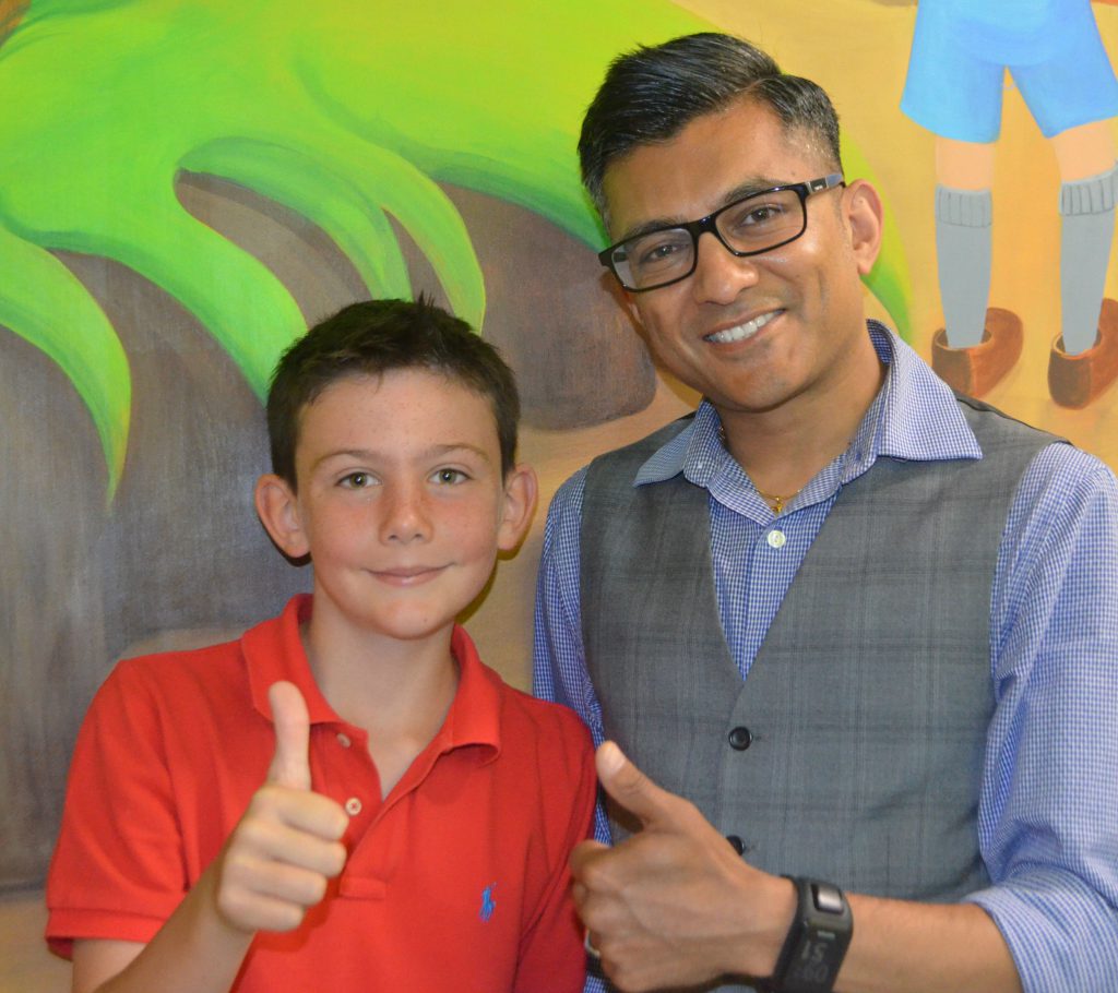 Dr Nick Makwana, Consultant Paediatrician, with patient Louis Malanaphy, who has a severe grass allergy and has been successfully treated by the Allergy Service at Sandwell Hospital.