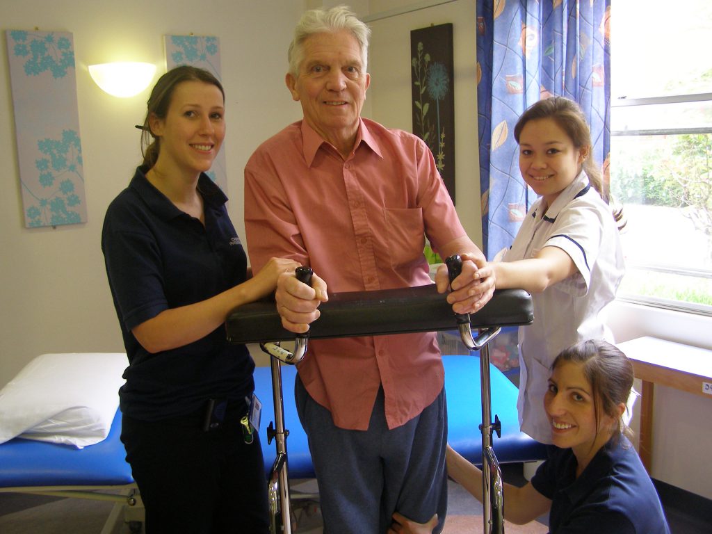 Staff aiding a stroke patient