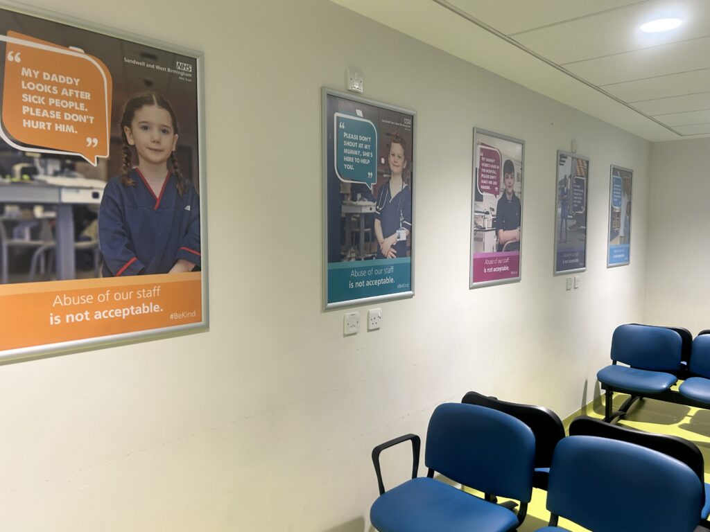 A row of anti-violence posters in a waiting room.