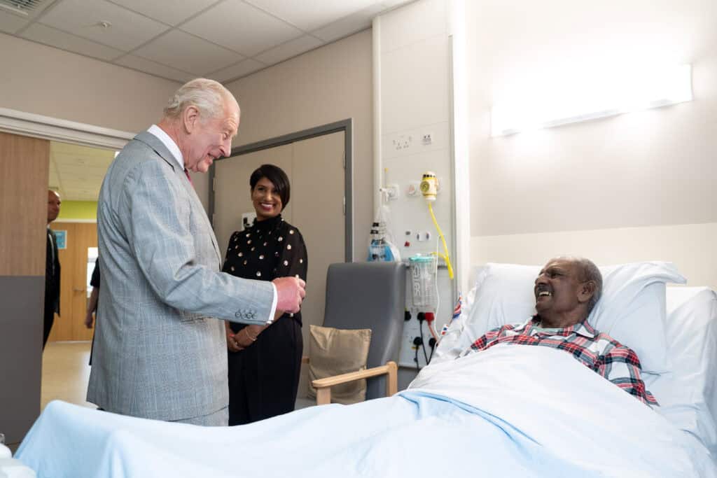 His Majesty King Charles meets a patient in hospital.