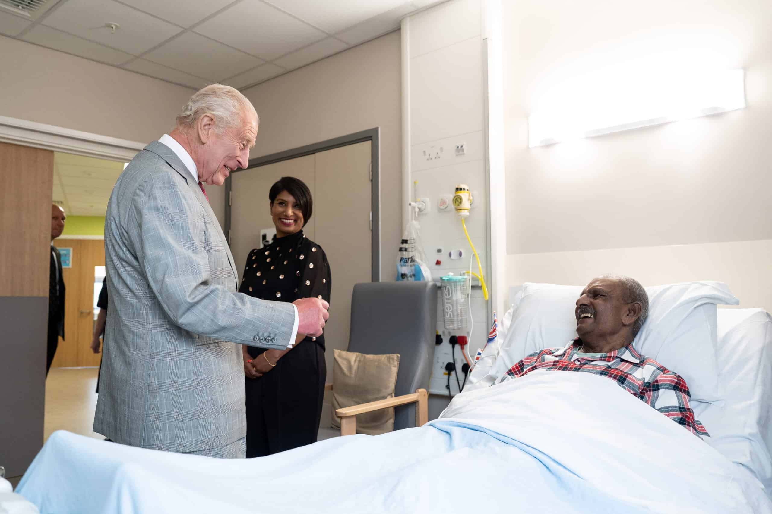 His Majesty King Charles meets a patient in hospital.