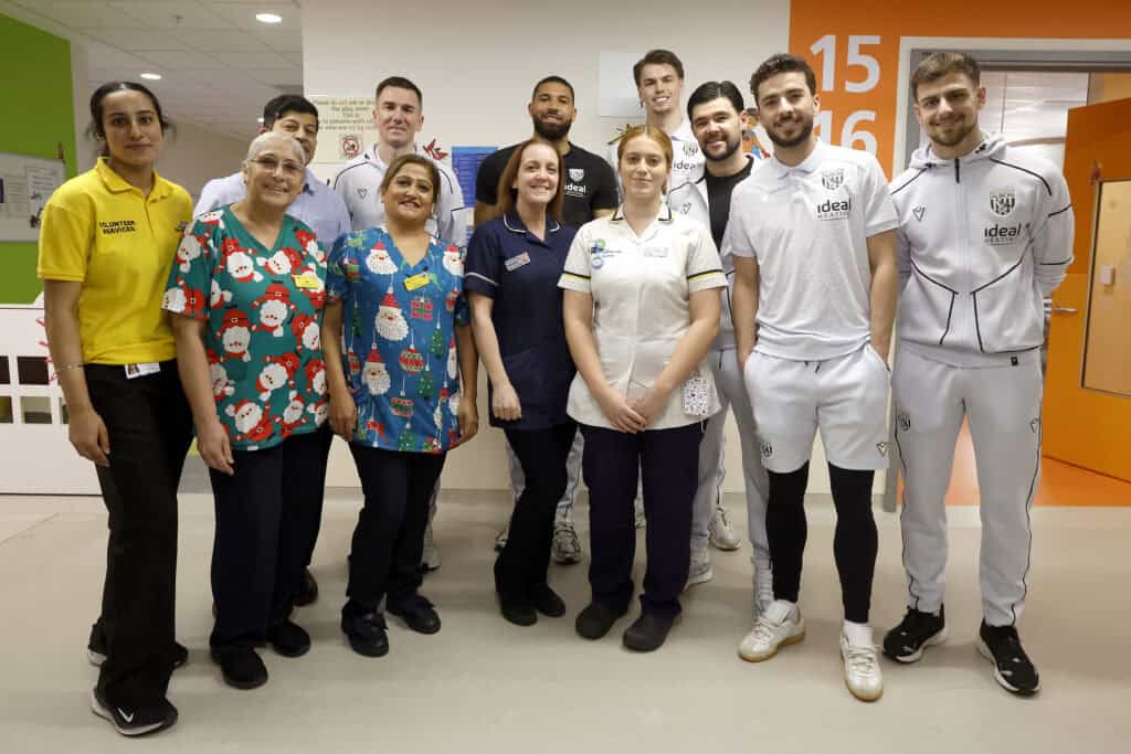 Football players from West Bromwich Albion with healthcare staff