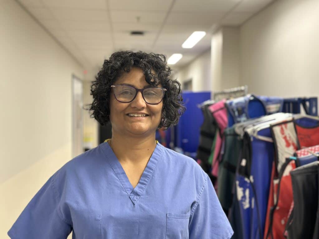 A photo of a consultant cardiologist inside a catheter lab.