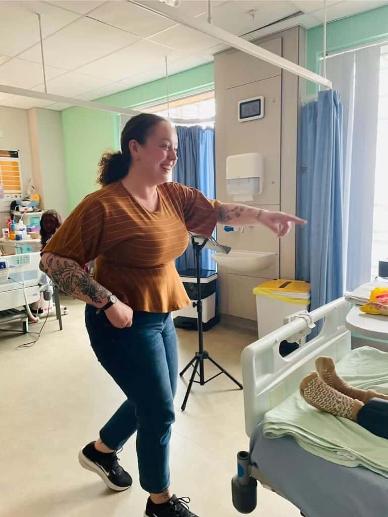 Samantha-Oxborough singing to patients